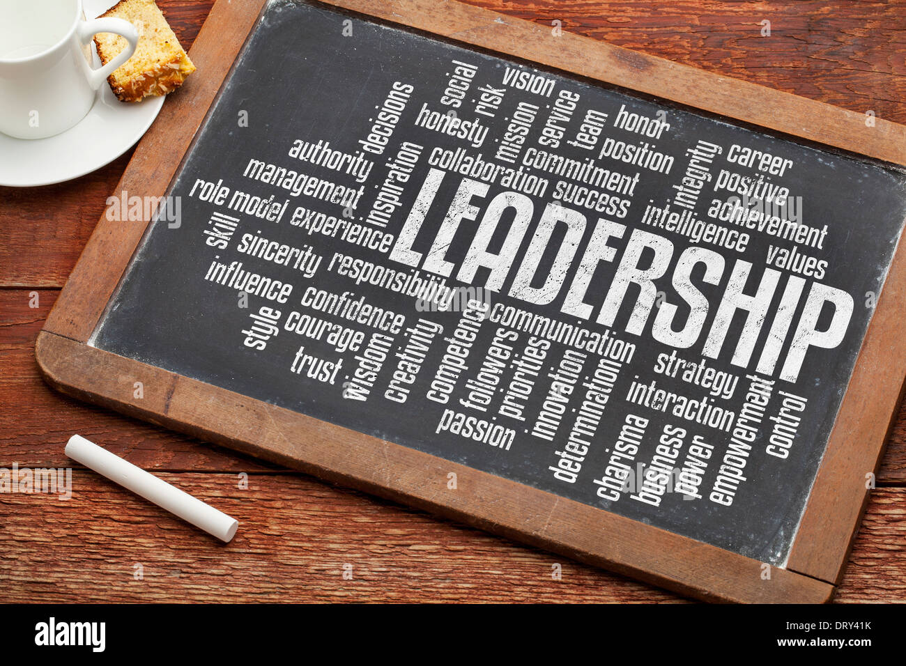 leadership word cloud on a vintage slate blackboard with a cup of tea Stock Photo