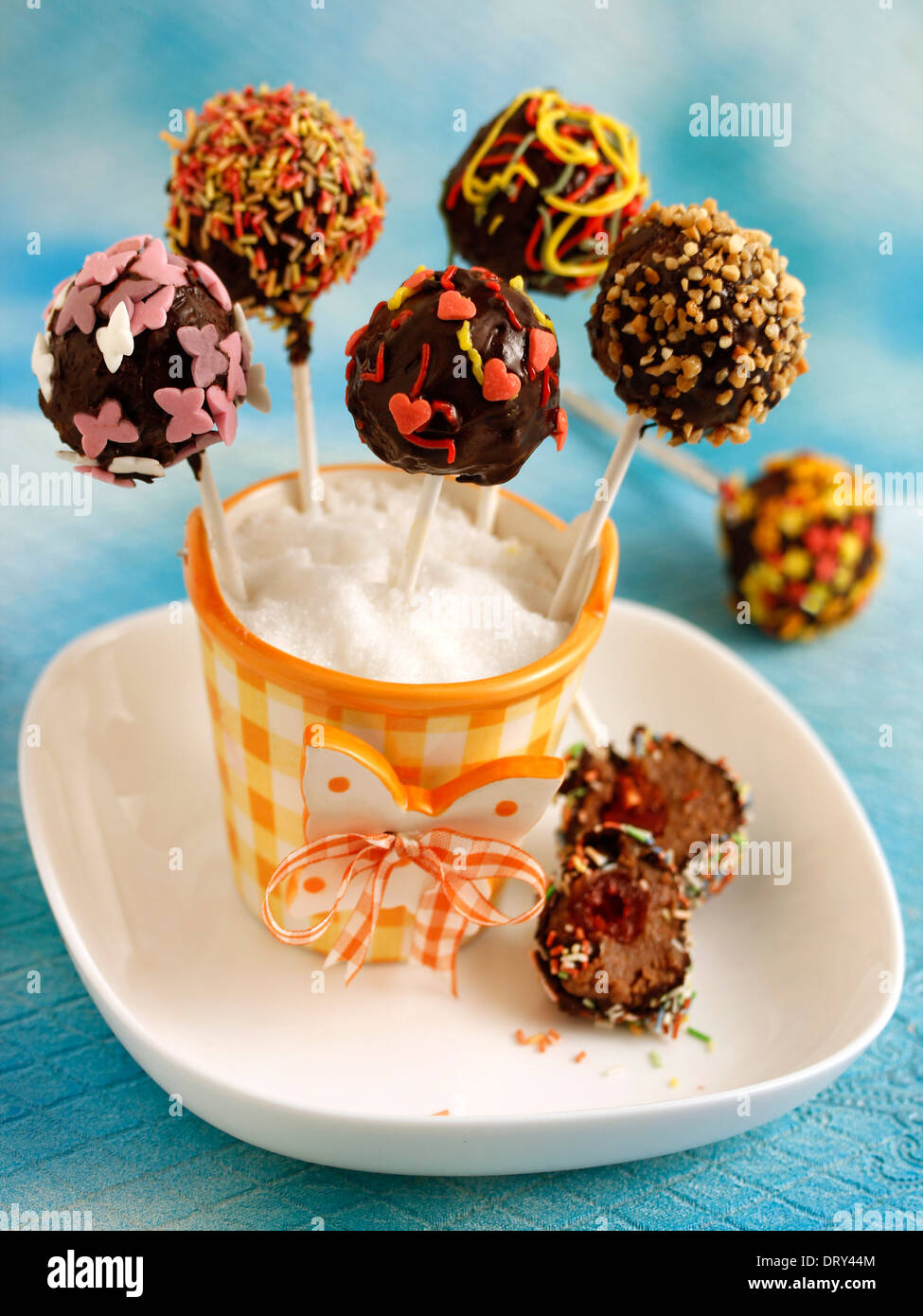 Chocolate cake pops with cherries. Recipe available Stock Photo Alamy