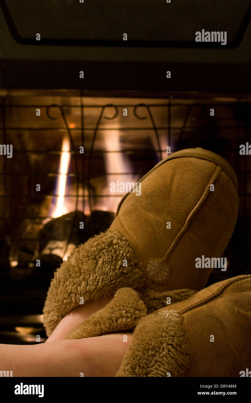 Cosy, Fireplace, Slippers, Warmth, Legs, Fire, Comfortable environment, Home, Living room. Lifestyle Stock Photo