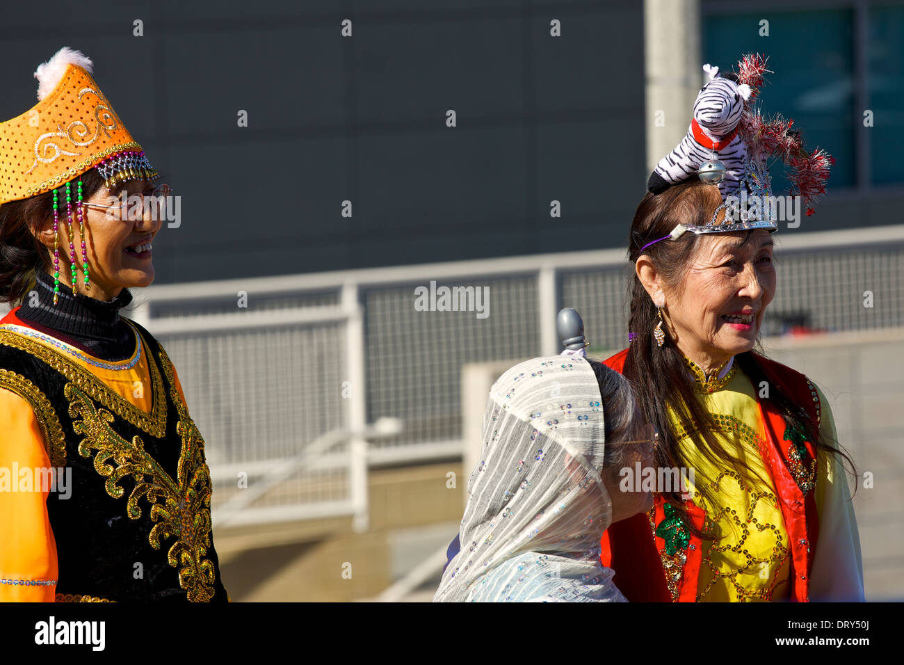 Chinese Ladies, dressed in ornate traditional costume, wait to appear in the Los Angeles Chinese New Year Parade. Stock Photo