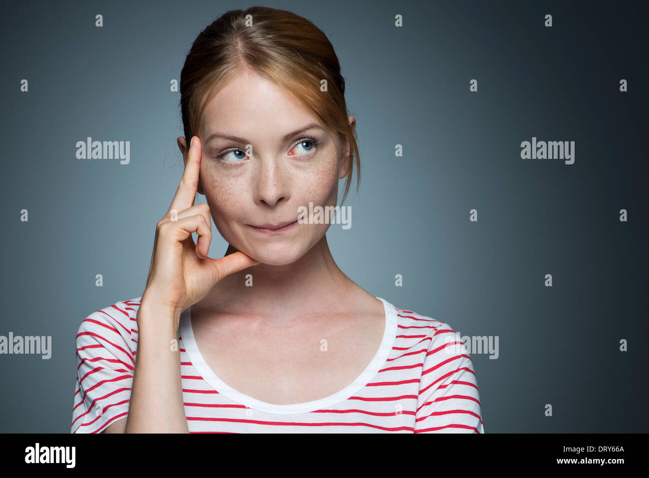 Young woman contemplating Stock Photo