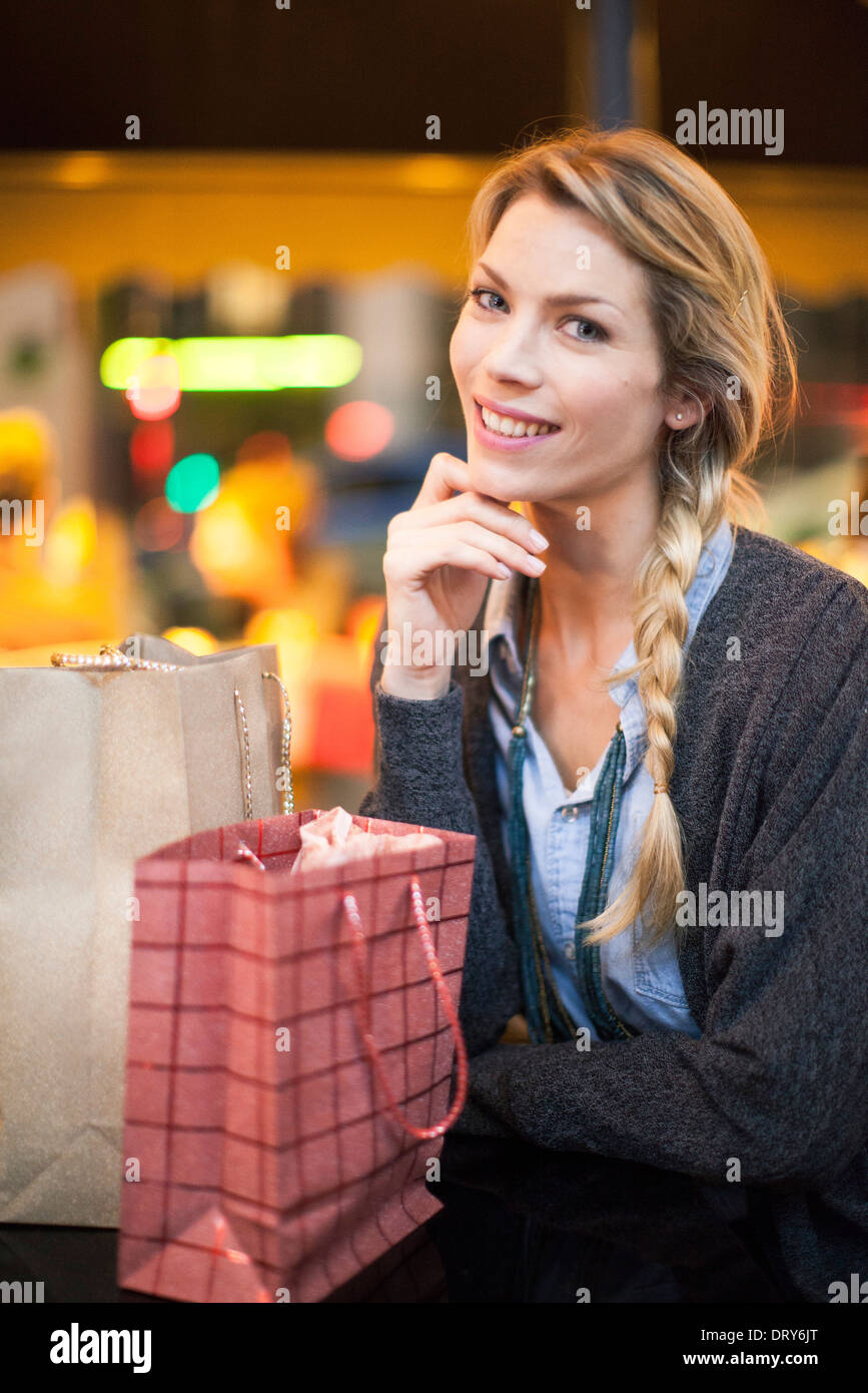 Satisfied shopper with her purchases, portrait Stock Photo