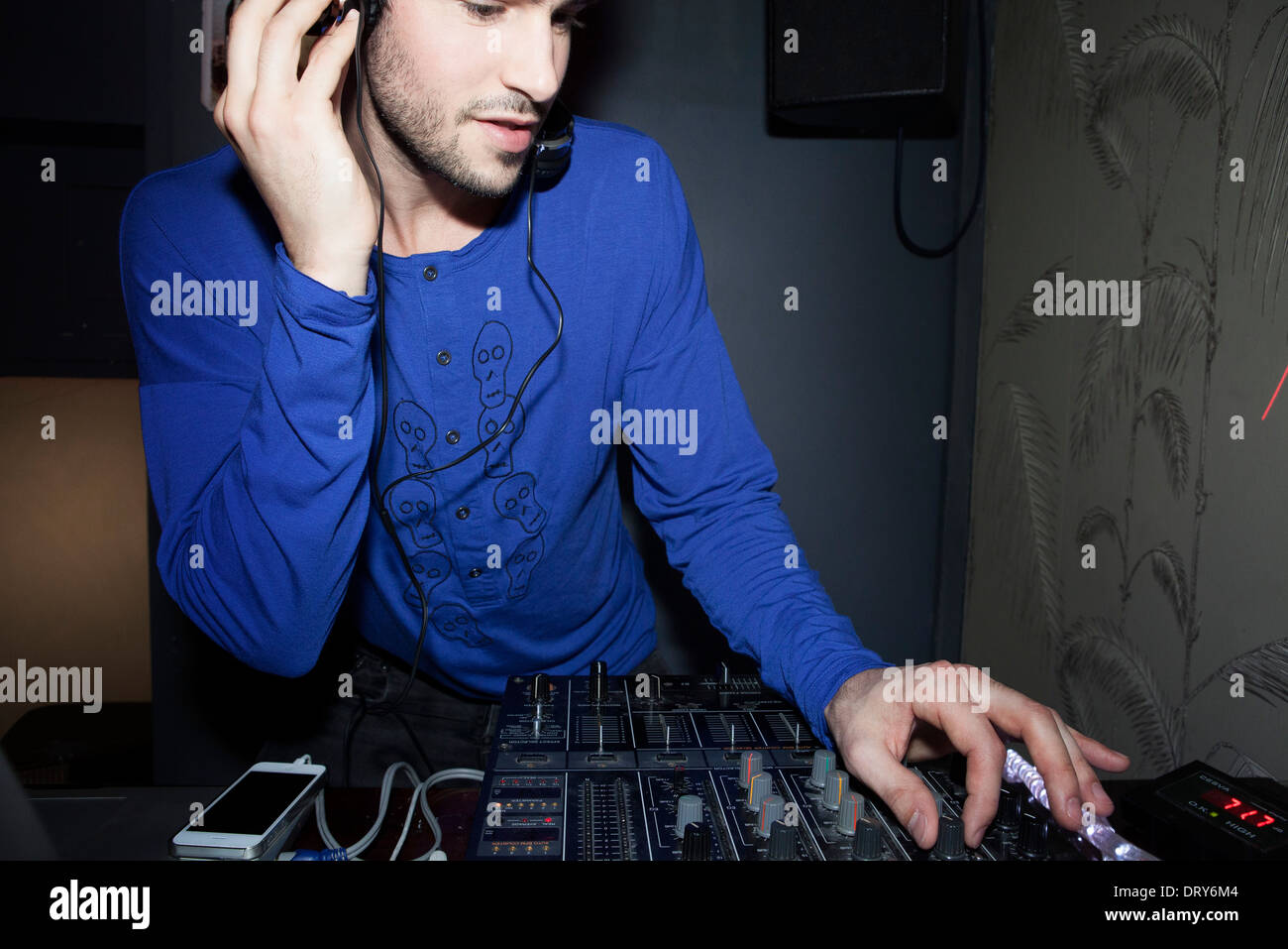 DJ using audio mixer Stock Photo Alamy