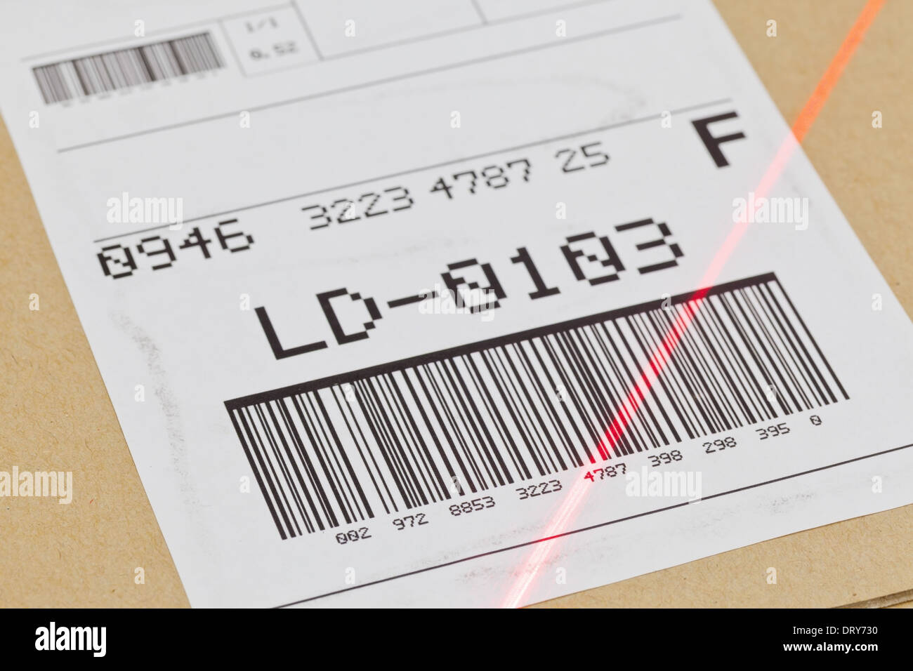 Barcode on shipping label on box scanned by automatic laser scanner