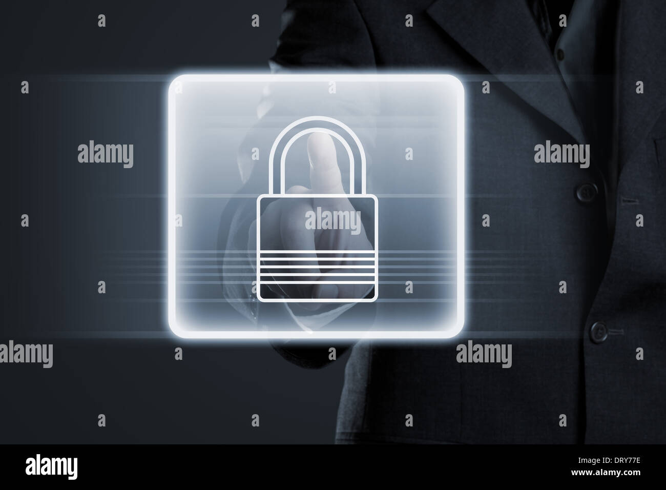 Businessman pressing lock button on futuristic touchscreen Stock Photo