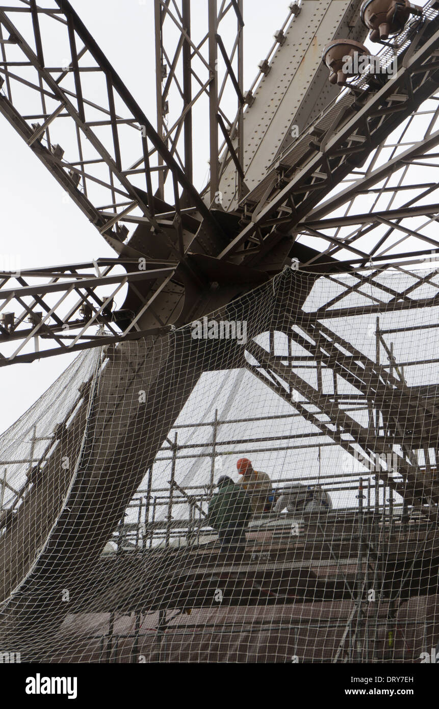 Detail of the interior steel construction of the Eiffel tower with workers. Paris, France. Stock Photo