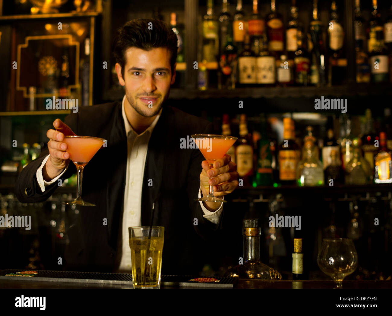 Bartender serving cocktails Stock Photo Alamy