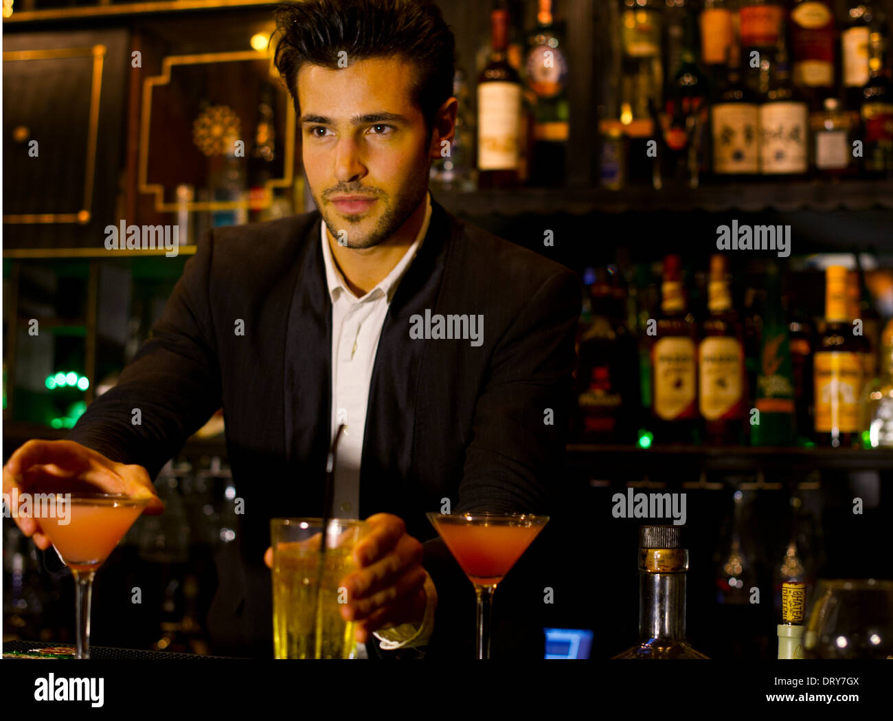 Bartender serving cocktails Stock Photo