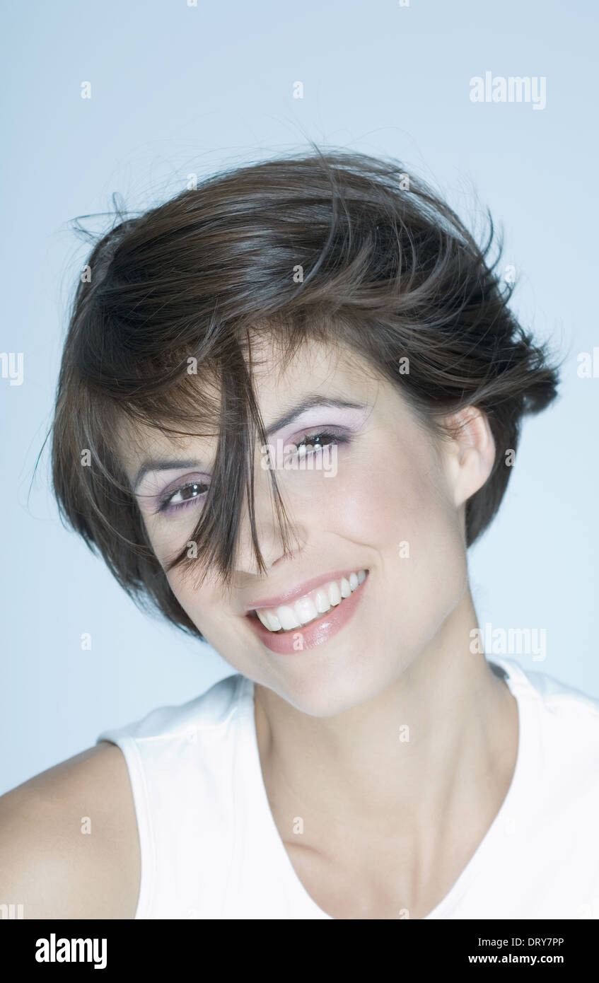 Woman With Short Hair Strand Of Hair In Front Of Face Smiling