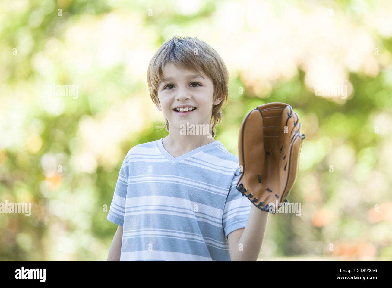 Boy wearing baseball glove Stock Photo Alamy