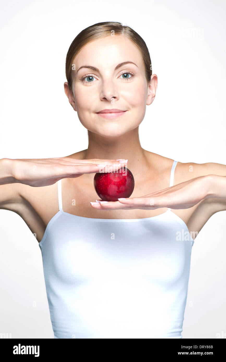 Young woman with apple Stock Photo
