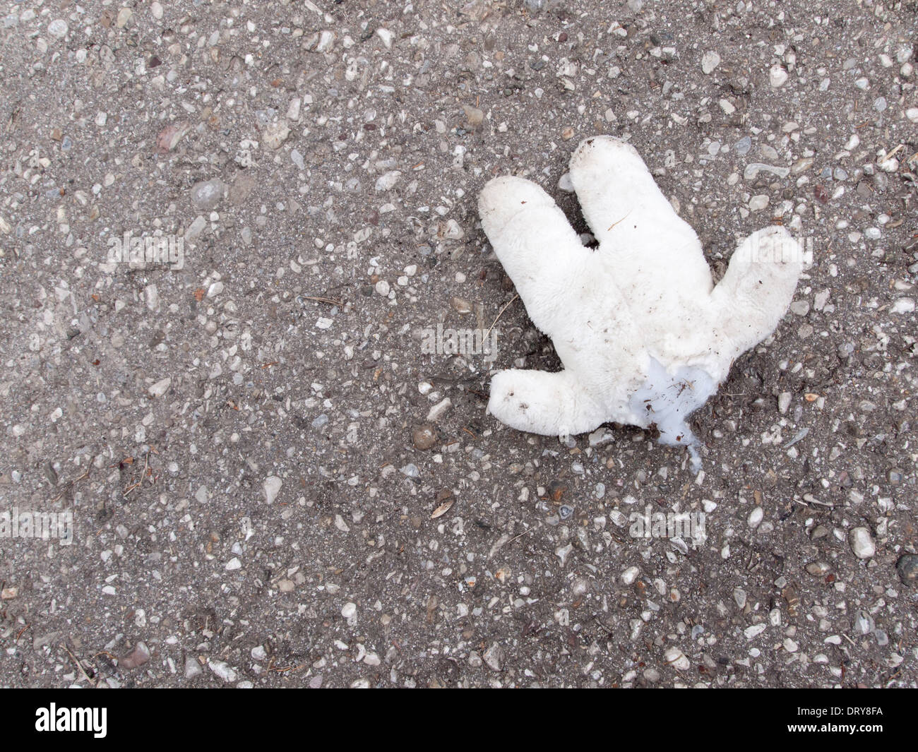 Headless Teddy-Bear abandoned on a parking lot Stock Photo