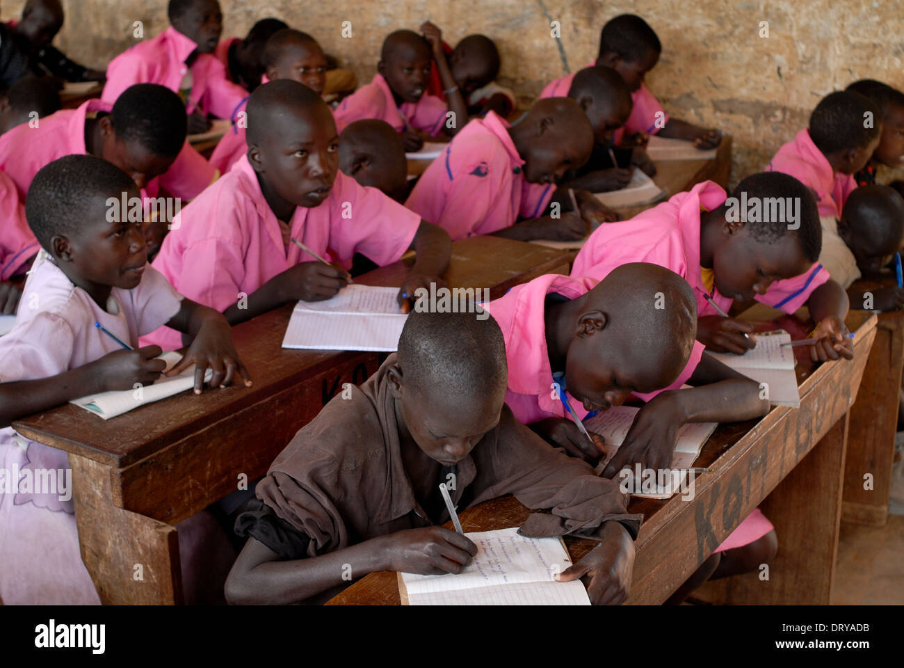 Uganda Karamoja Kotido, Karimojong children with pink school uniform  in primary school, Karimojong is a nilotic pastoral tribe Stock Photo
