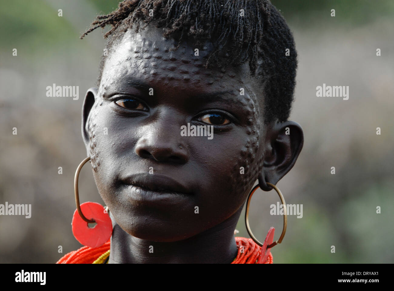 Uganda Karamoja Kotido, Karimojong people, pastoral tribe, woman with face scarification Stock Photo