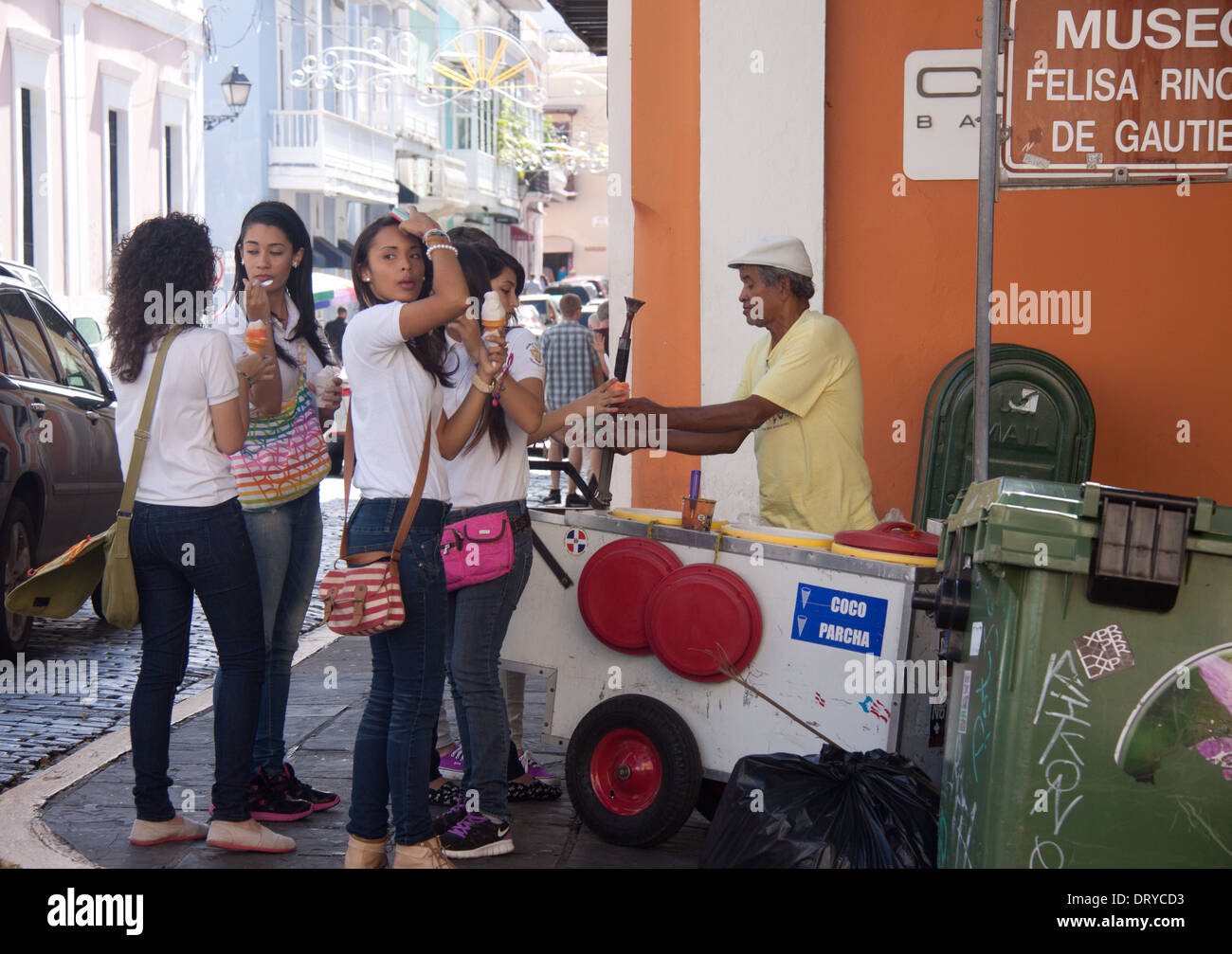 School girls buying ice cream from a street vendor in Old San Juan