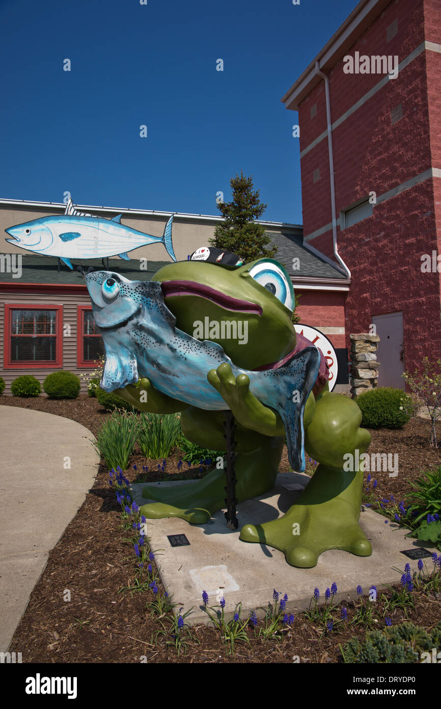 Restaurant at the Docks on Maumee River in downtown Toledo Ohio USA with a frog and walleye sculpture in front Stock Photo