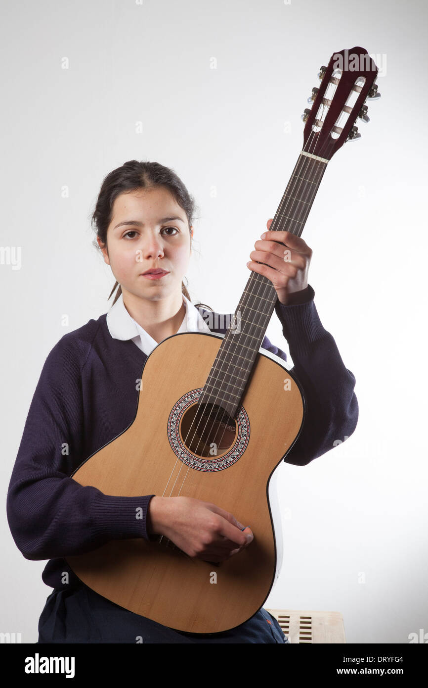 Portrait of schoolgirl with her guitar Stock Photo