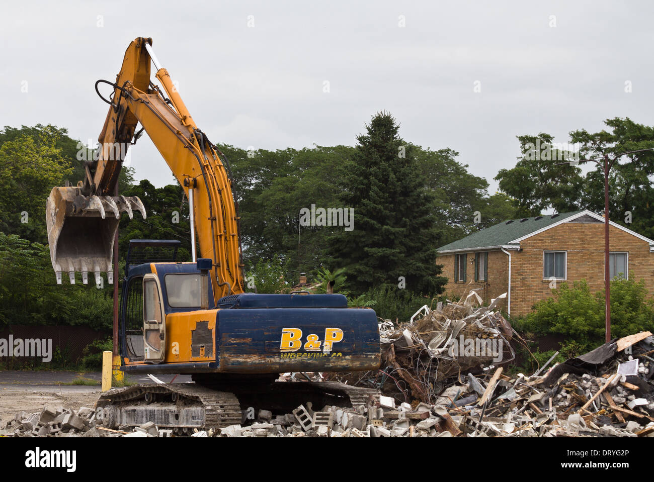 Digger bucked..Demolished building in the city. Digger with backhoe