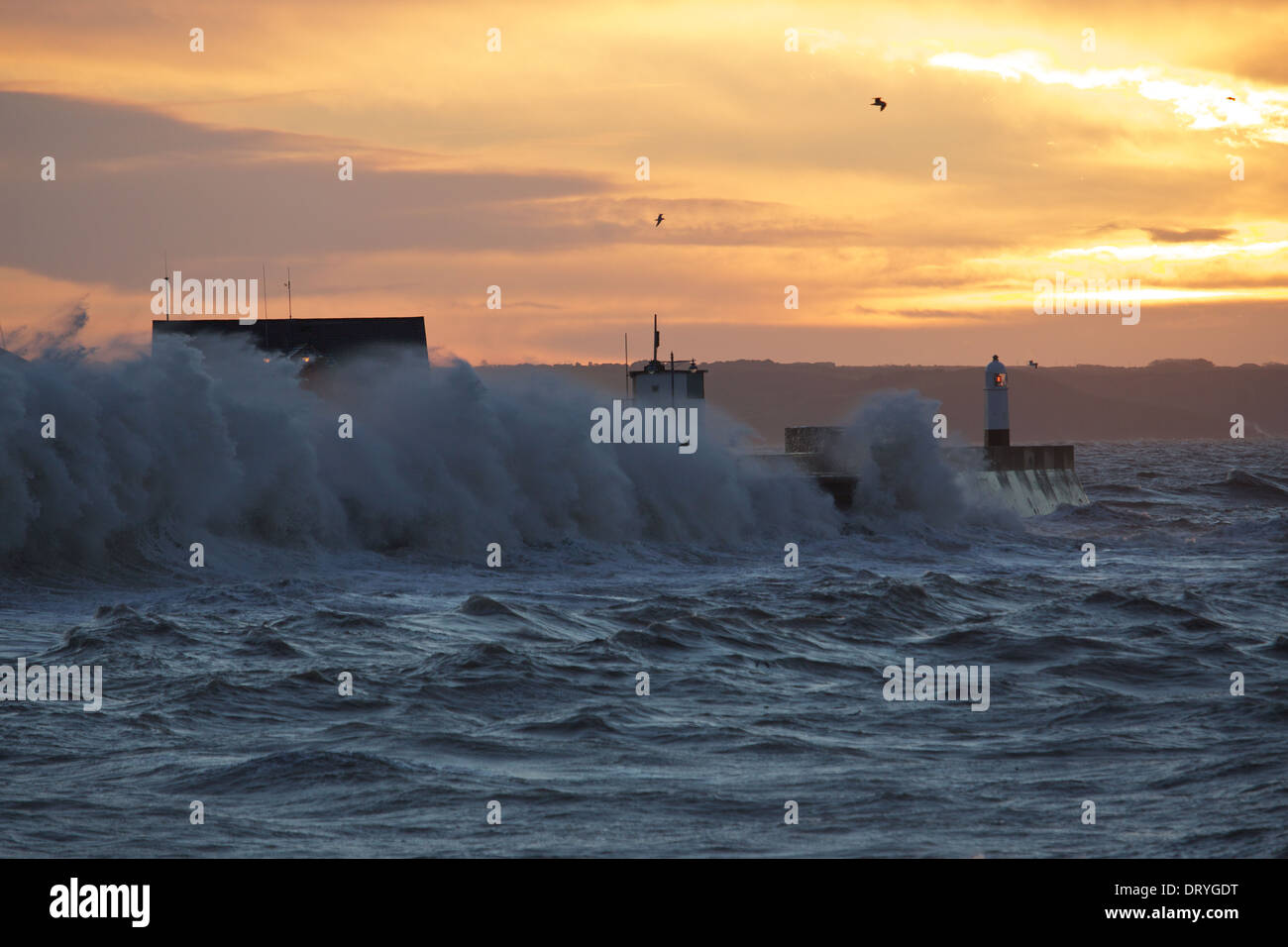 Winter storm and huge waves hit coastline at Porthcawl during sunrise ...