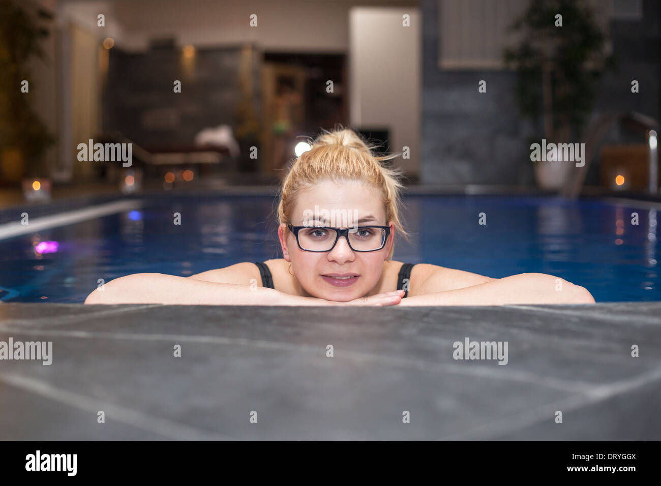 Happy woman in wellness and spa swimming pool. Stock Photo