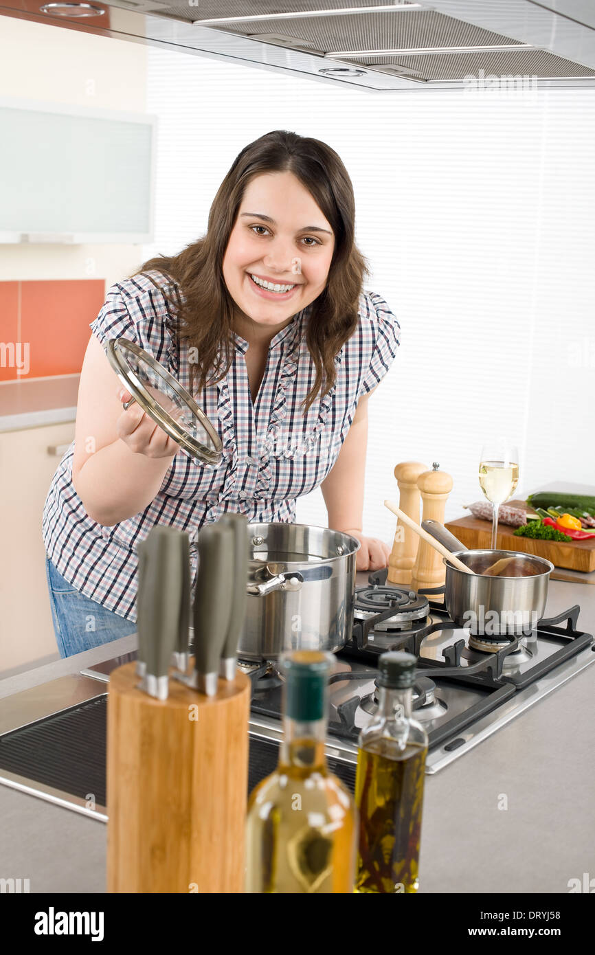 Cook - plus size woman in modern kitchen Stock Photo