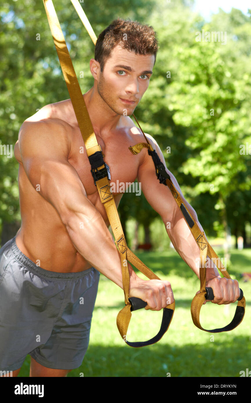Handsome man doing exercises Stock Photo