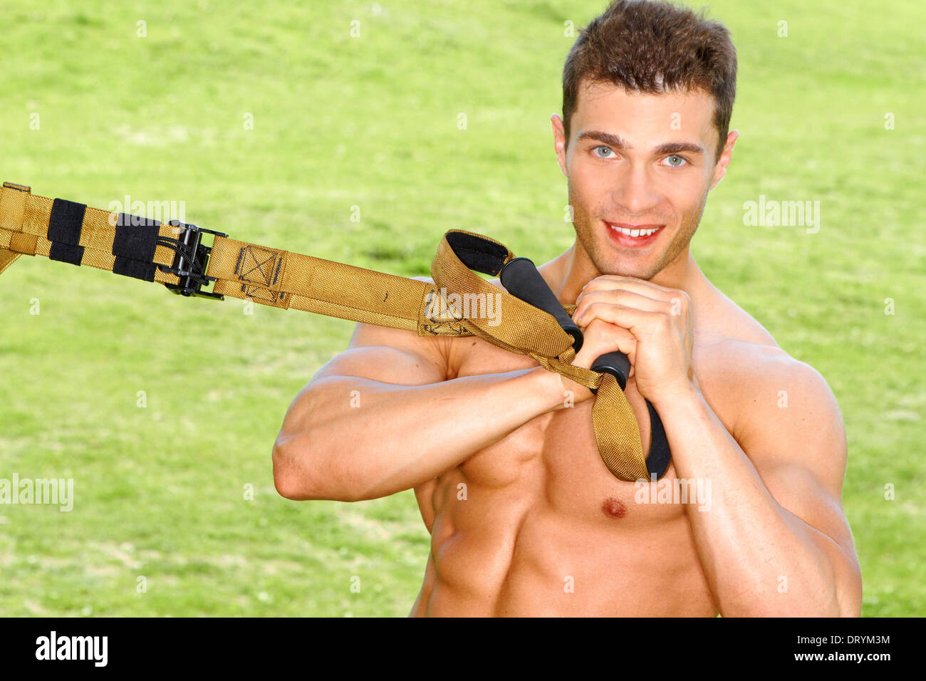 Handsome man doing exercises Stock Photo