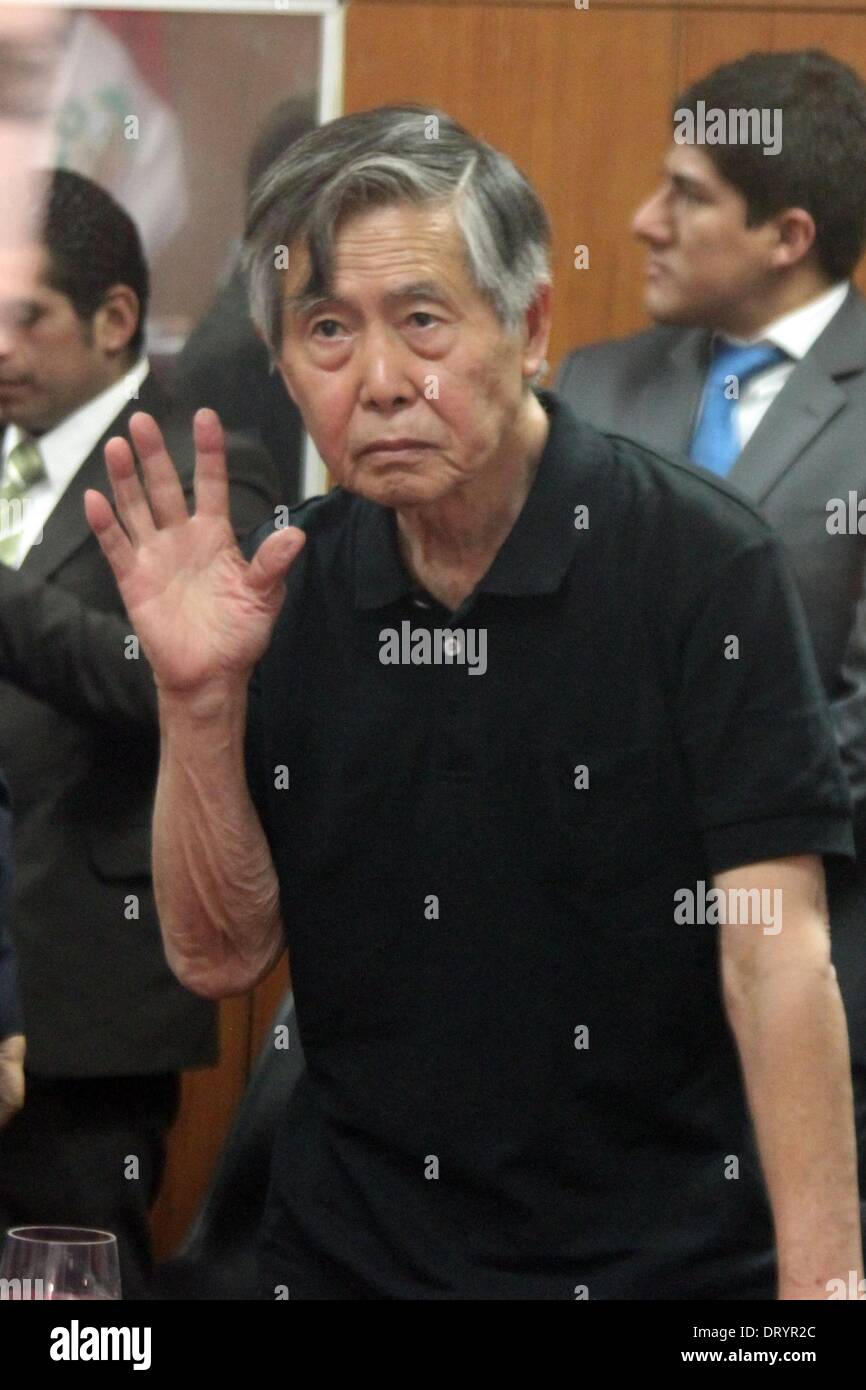 Lima. 25th Oct, 2013. Image taken on Oct. 25, 2013, shows Peruvian former President Alberto Fujimori waving during a hearing of his trial, in Lima, Peru. Fujimori was transferred to the Vitarte Hospital in Lima Department, Peru, due to a hypertensive crisis after a court hearing, according to the local press. © Luis Camacho/Xinhua/Alamy Live News Stock Photo