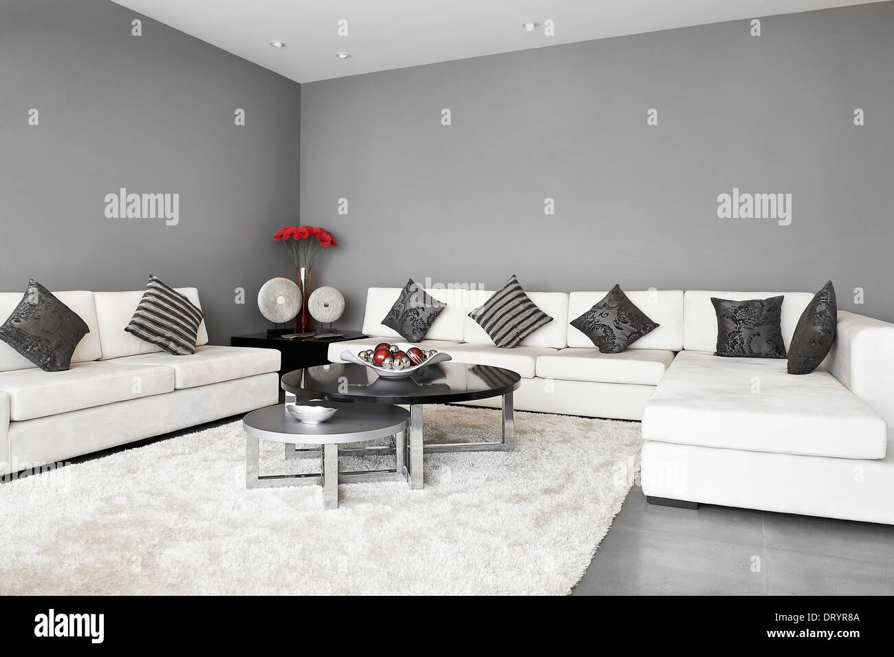 Interior Design: Living room with big empty wall Stock Photo - Alamy