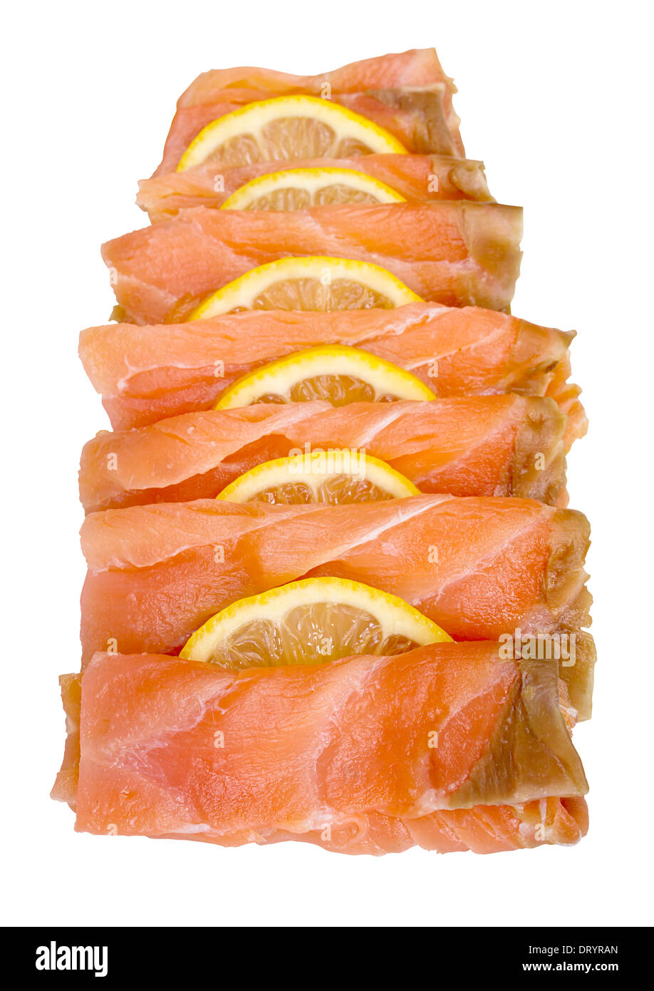 Smoked salmon sliced and arranged with lemon slices isolated against a white background Stock Photo