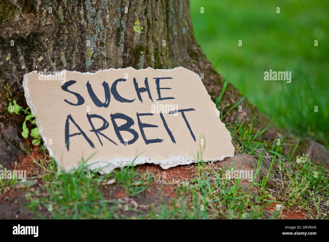 Cardboard sign showing the german term Suche Arbeit (in english looking for a job) Stock Photo