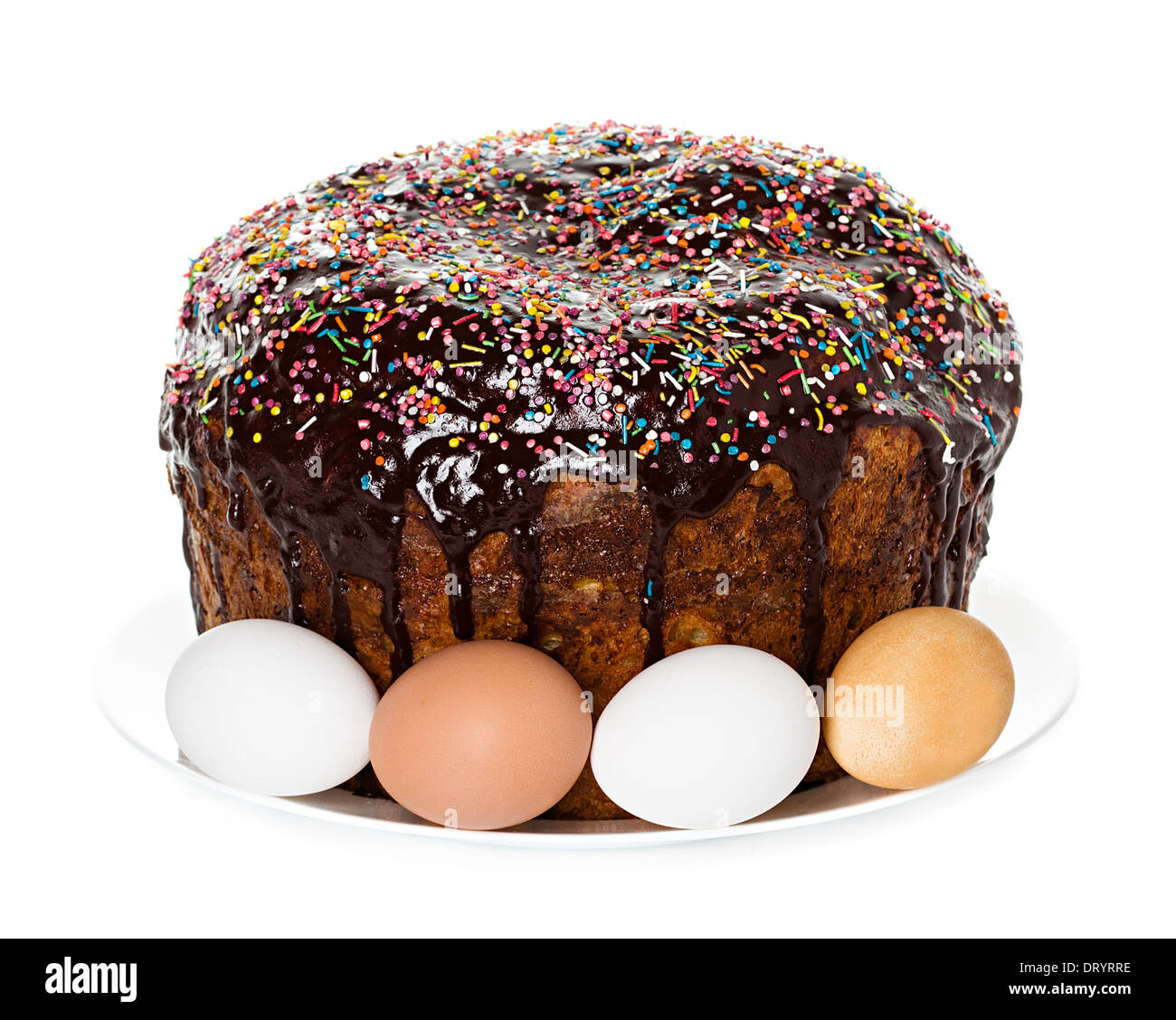 Easter cake with glace icing and easter eggs on white background Stock Photo