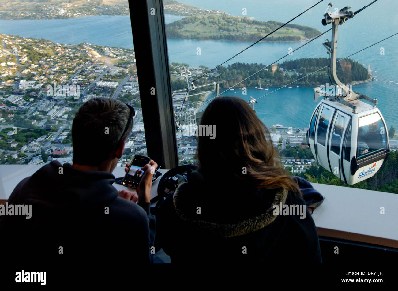 Tourists at the Skyline Cafe in Queenstown, New Zealand Stock Photo