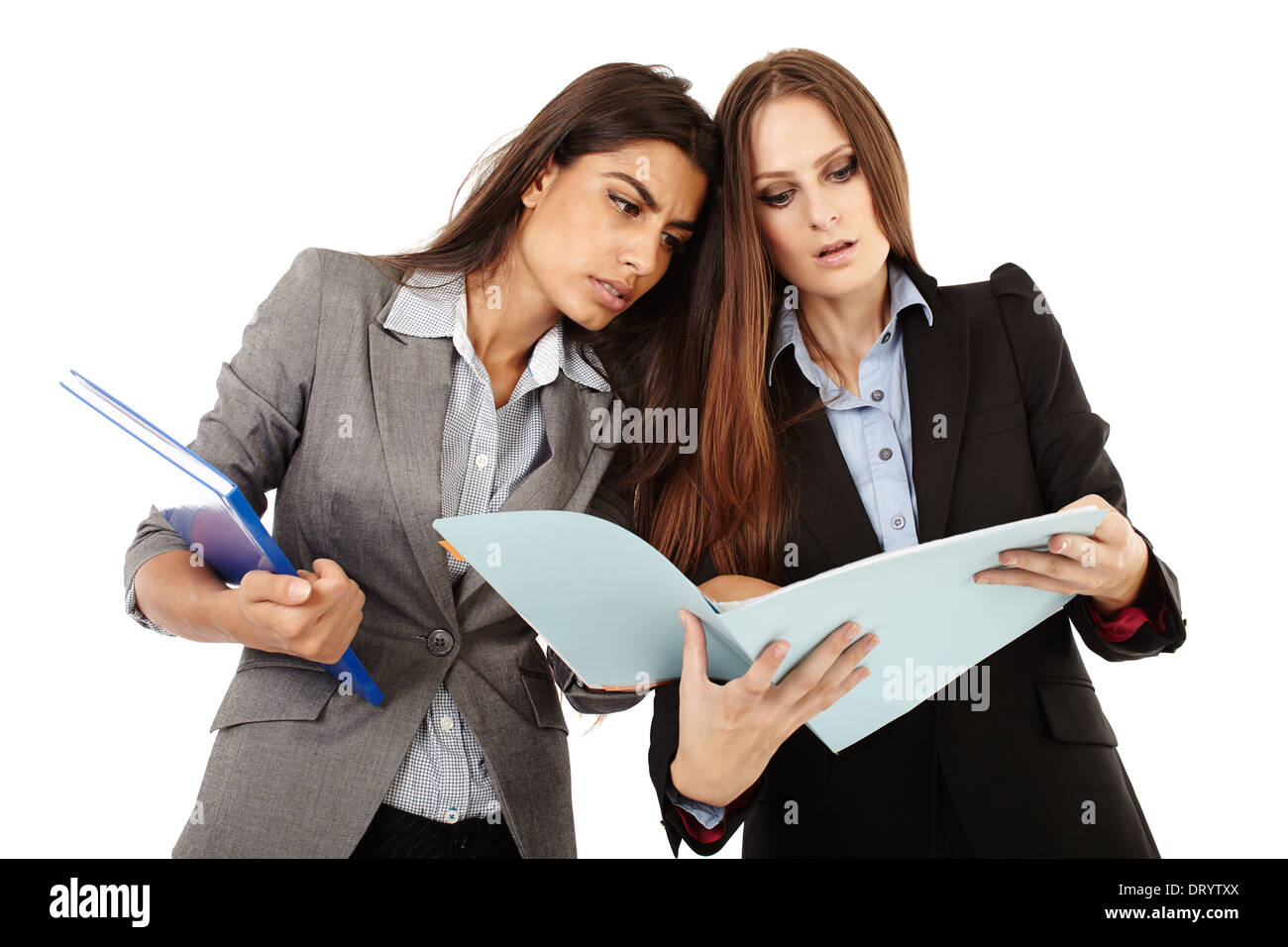 Two successful businesswomen dicussing and looking to documents isolated on white Stock Photo