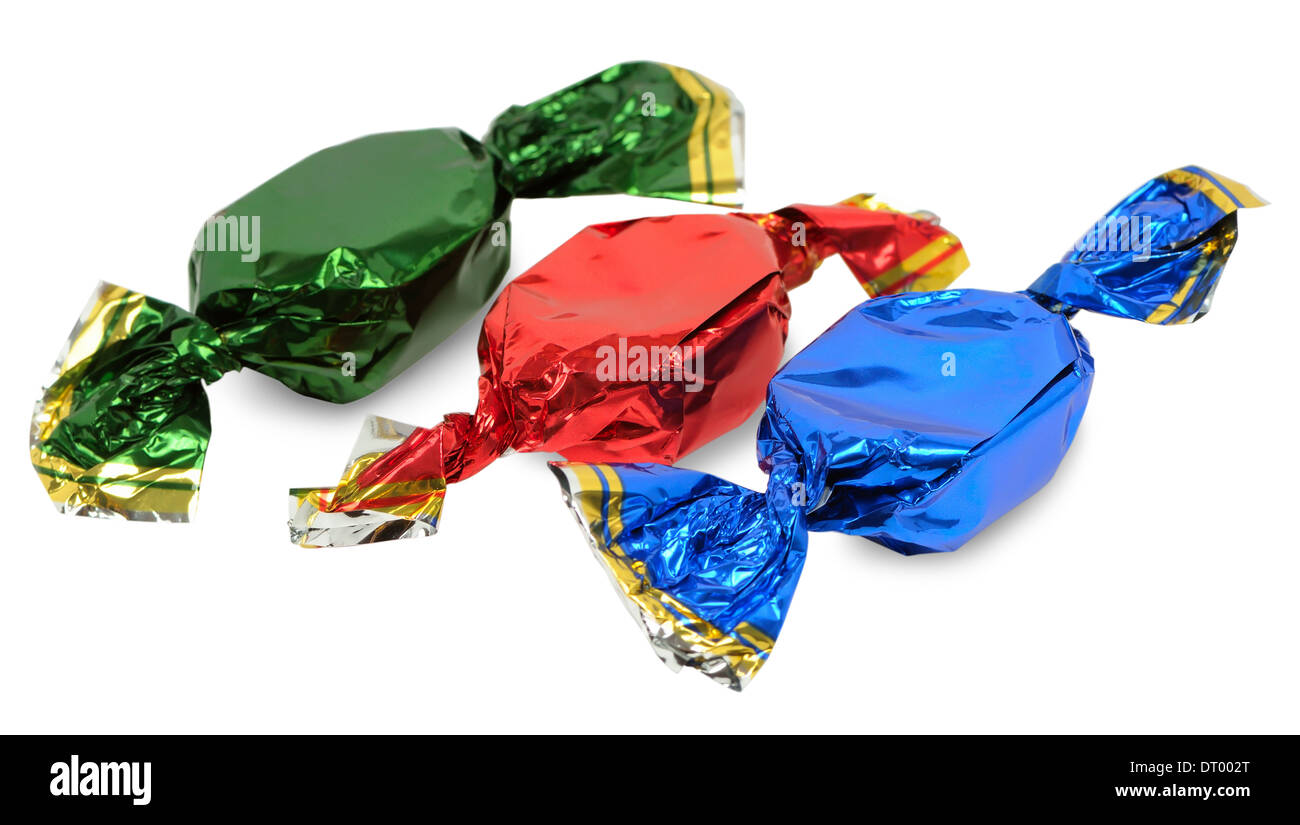 Three chocolate candies with wrappers of different colors on a white background Stock Photo Alamy