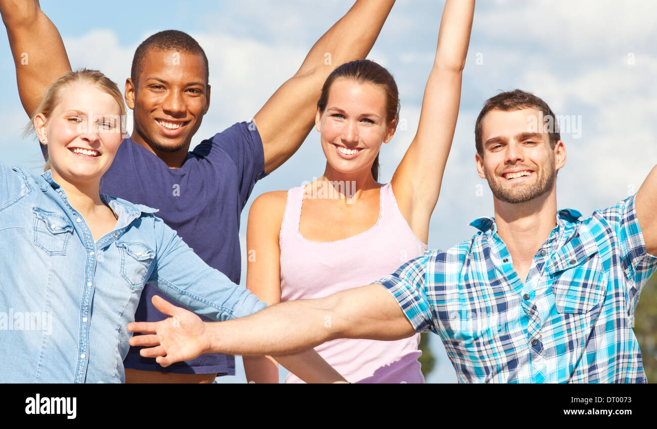 Four young people having fun outside. Stock Photo