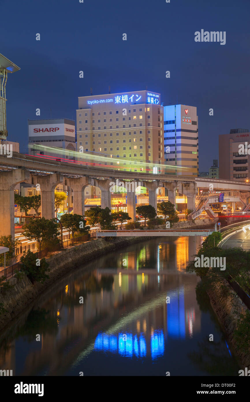 Asahibashi monorail station and downtown Naha at dusk, Okinawa, Japan Stock Photo