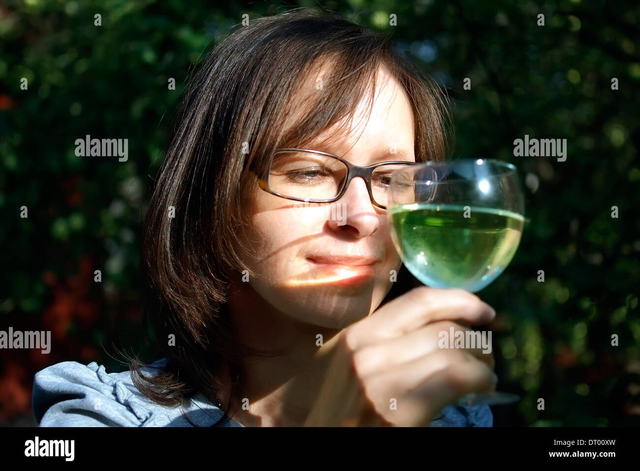 Woman holding glass of wine hi-res stock photography and images - Alamy
