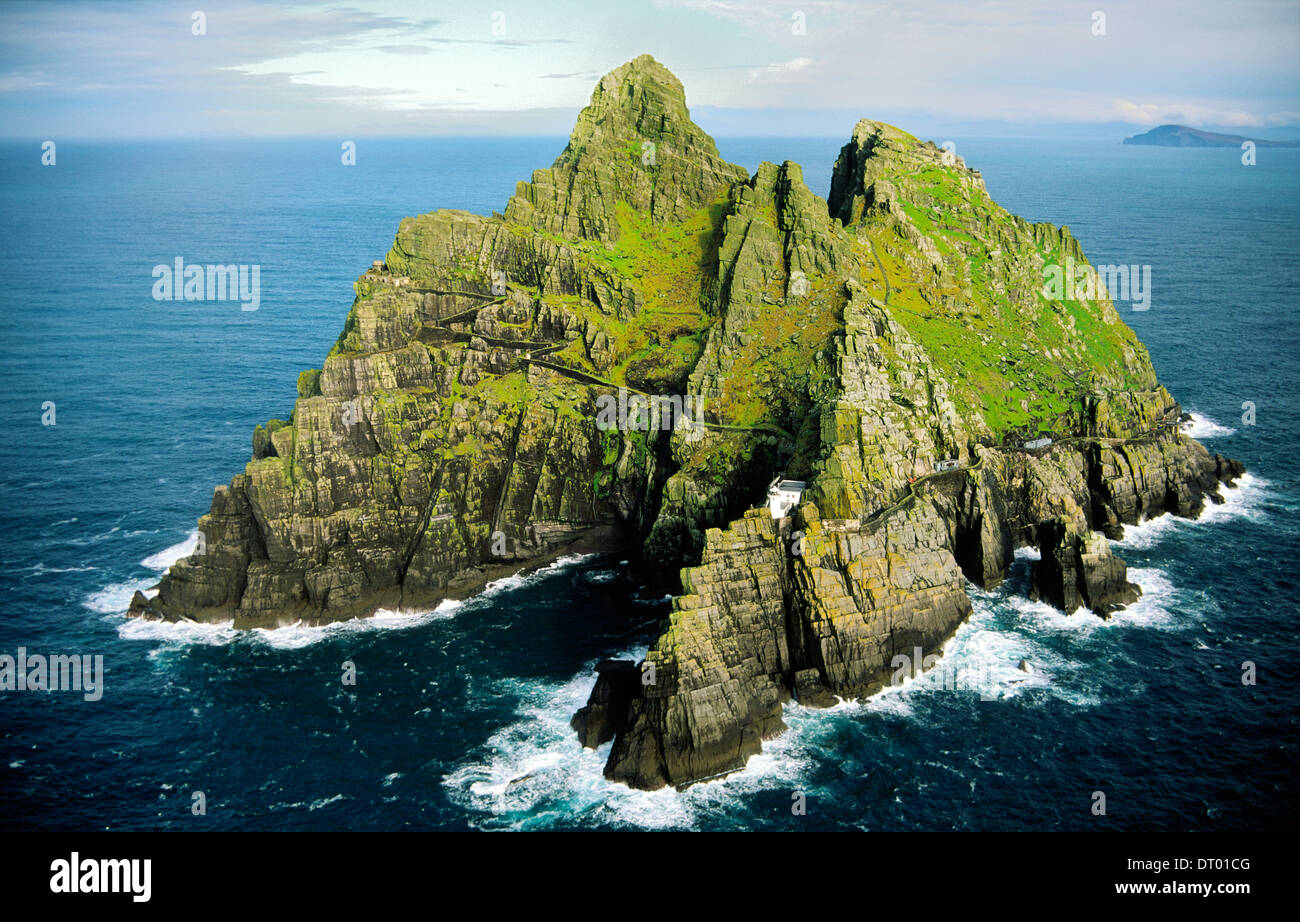 Skellig Michael, Kerry, Ireland. Celtic Monastic settlement on right side summit. New lighthouse centre. Old lighthouse left Stock Photo