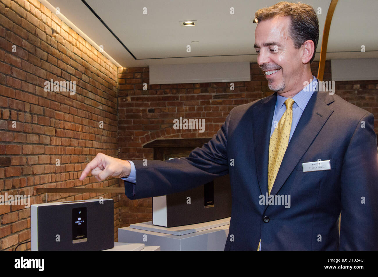 At the unveiling of the Bose SoundTouch system in New York, Bose's Vice President of Home Entertainment, Product Development, Tim Saeger, points at a SoundTouch 20 speaker. October 2013 Stock Photo