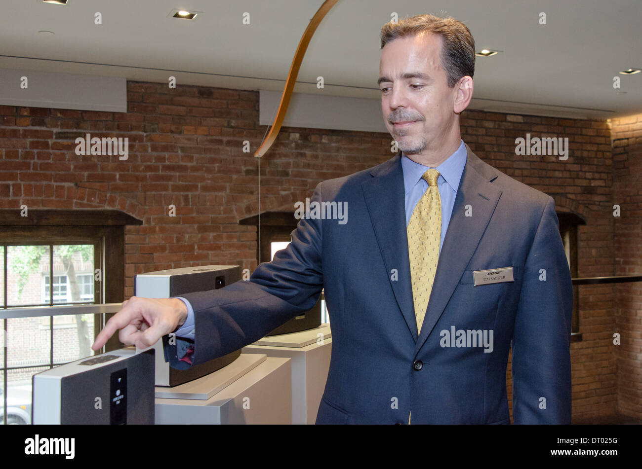 Bose's Vice President of Home Entertainment, Product Development, Tim Saeger showing the preset buttons that make the company's SoundTouch speaker systems independent of mobile phones and computers. October 2013 Stock Photo