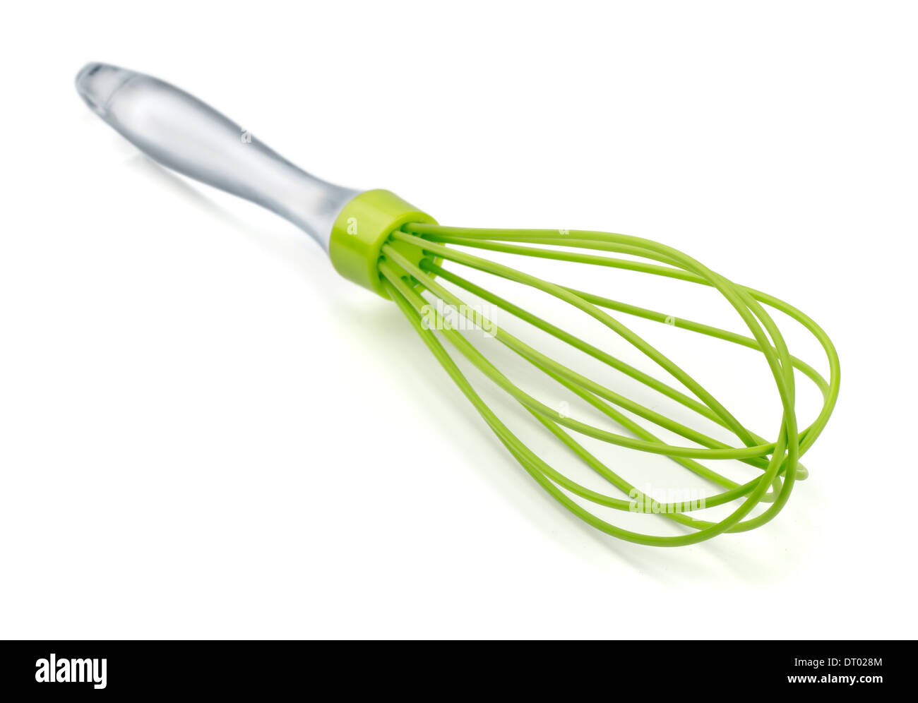 Green plastic kitchen whisk isolated on white Stock Photo