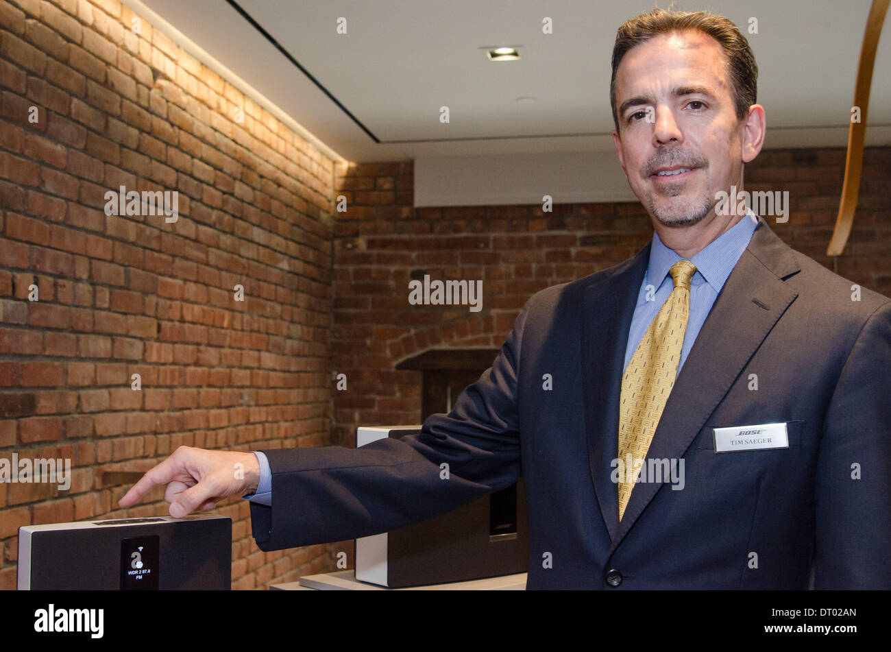 At the unveiling of the Bose SoundTouch system in New York, Bose's Vice President of Home Entertainment, Product Development, Tim Saeger, points at a SoundTouch 20 speaker. October 2013 Stock Photo