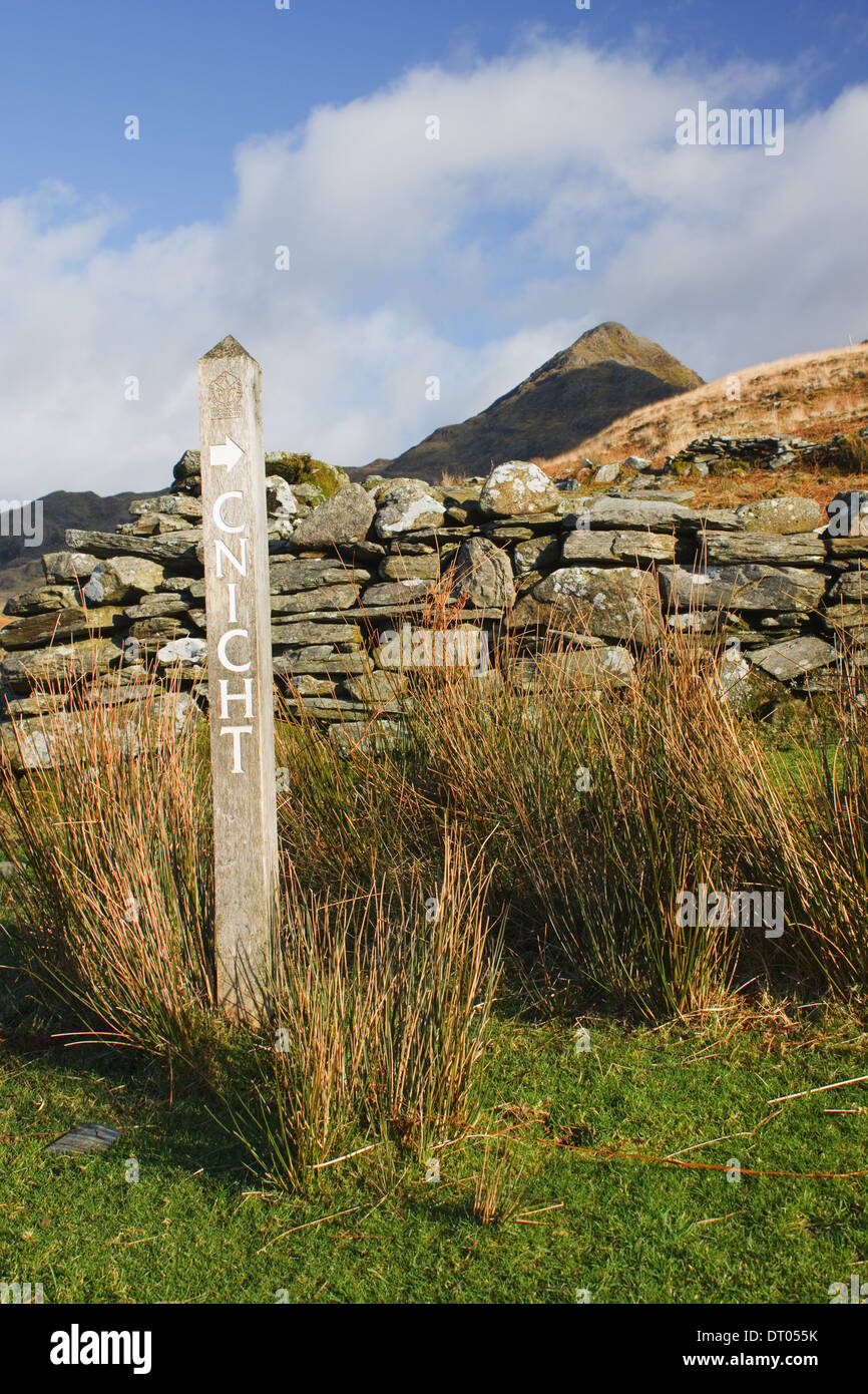 A footpath sign pointing at the mountain of Cnicht in the Moelwynion