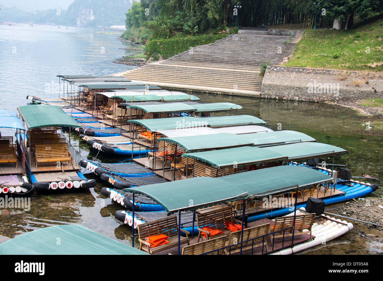 China, Yangshuo County, Bamboo rafts on the Yulong River Karst formations Stock Photo
