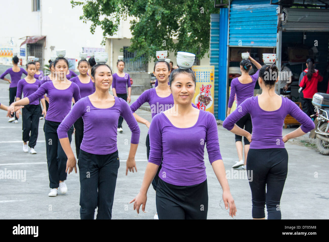 China, Guilin, schoolgirls dance during a sports lesson Stock Photo