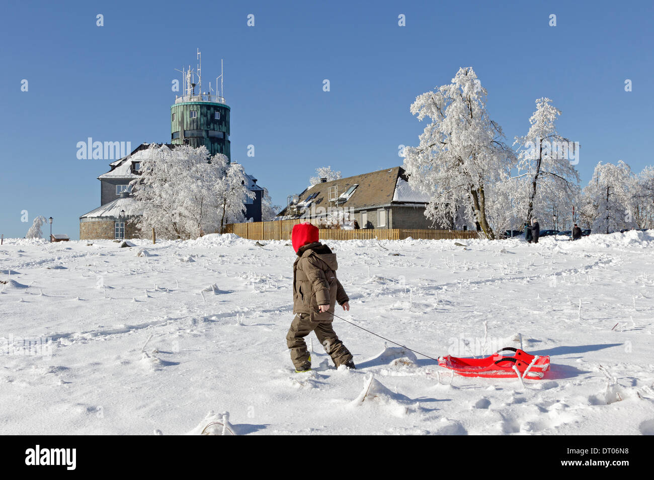 young boy with his sled, Kahler Asten, Sauerland, North Rhine-Westfalia, Germany Stock Photo
