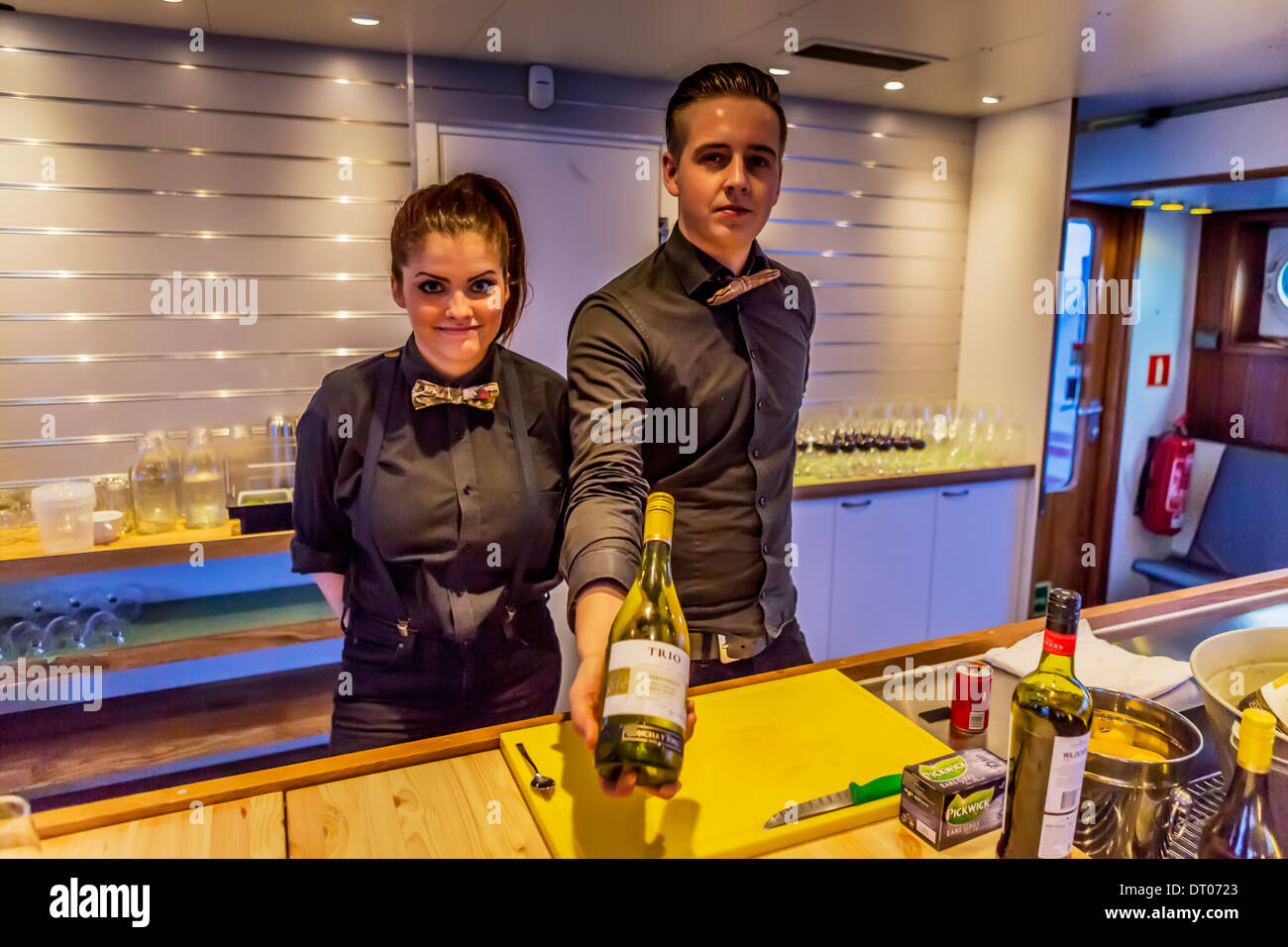 Waiters on dinner cruise, Reykjavik, Iceland Stock Photo