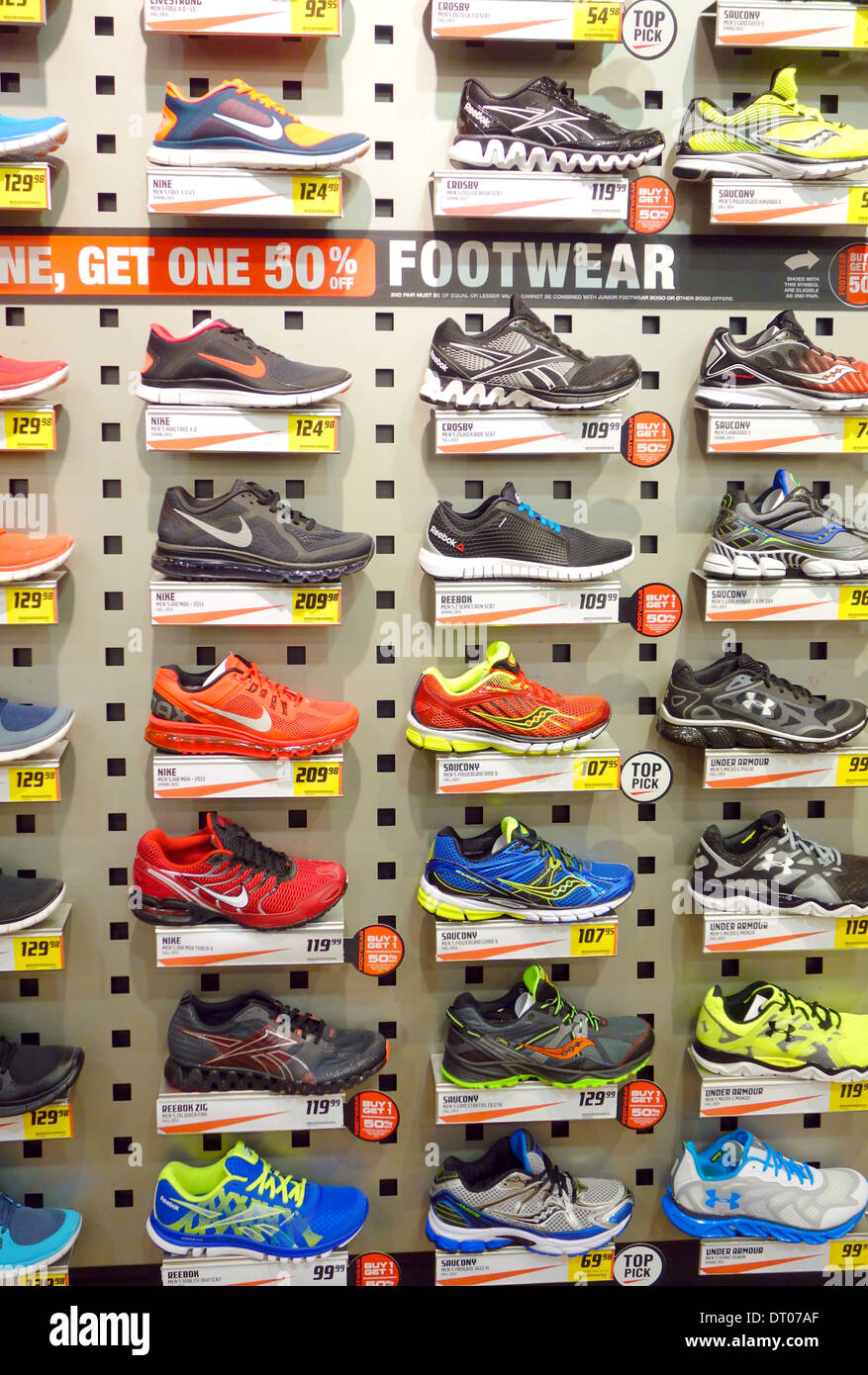 Running shoes on display in a sports apparel store Stock Photo
