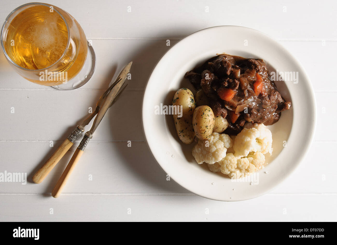 Meat stew and a pint of beer. Stock Photo